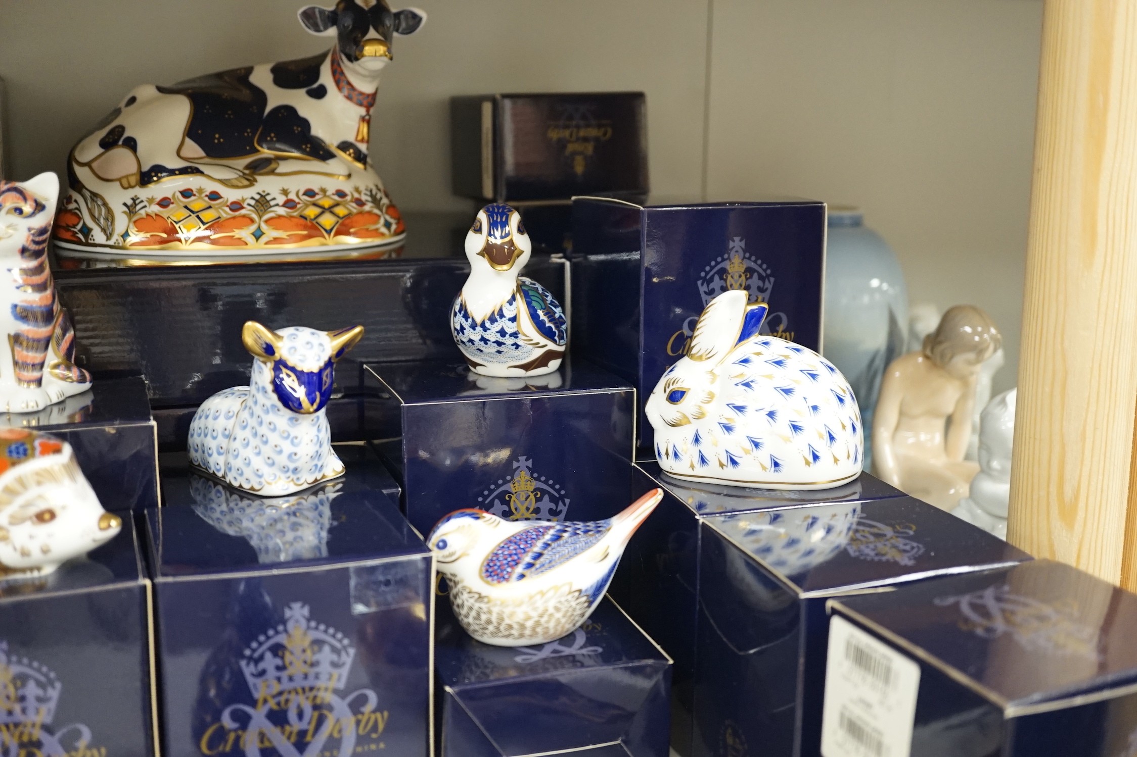 Approximately thirty-two Royal Crown Derby Imari porcelain paperweights, all but two with original boxes and mostly gold bottoms